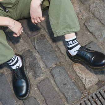 Close up image of the low cut doc marten shoes