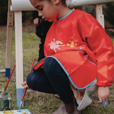 Child wearing blundstone boots painting